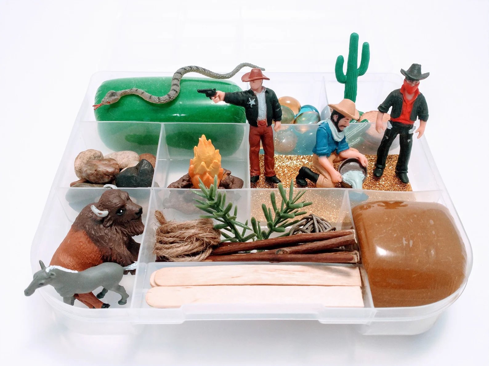 western themed sensory toy box gift, compartments with cowboys, toys, and playdough for kids